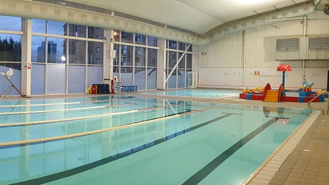 Images of empty hallways, cafeterias, supermarket aisles, and a pool.