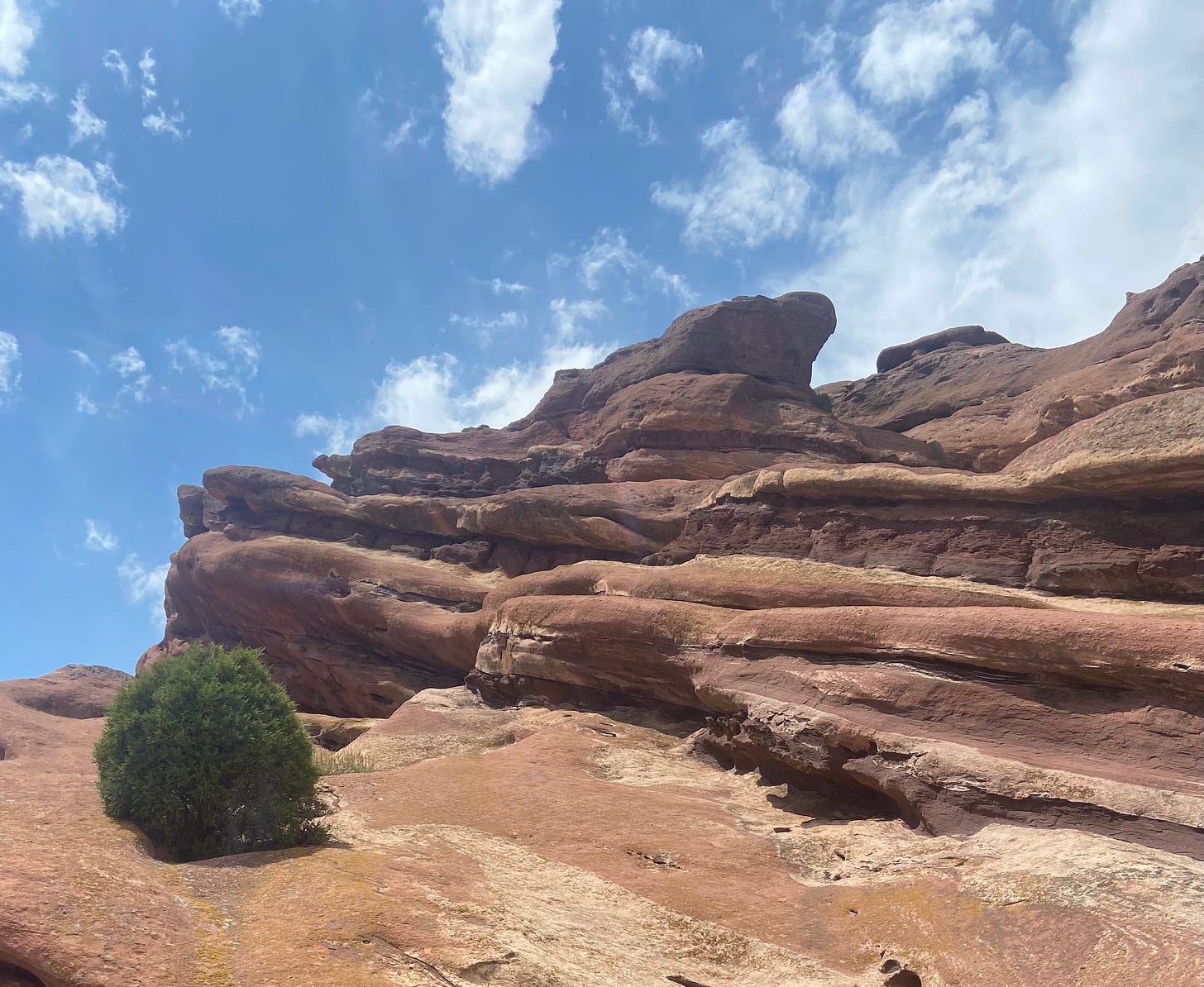 blue sky with white clouds over the Red Rocks blue sky with white clouds over the Red Rocks
