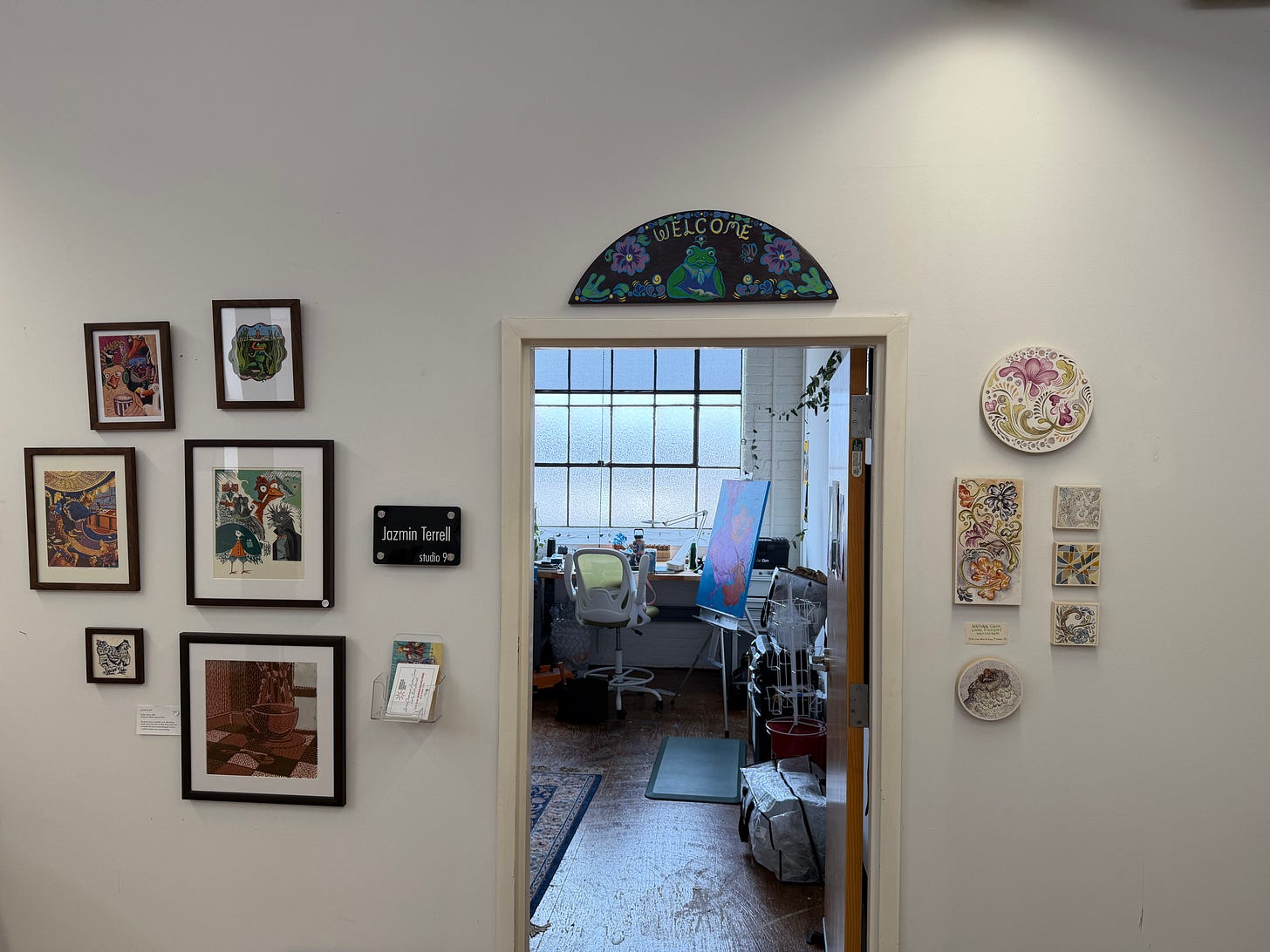 My doorway with my welcome sign hung above it and my artwork framing both sides. My doorway with my welcome sign hung above it and my artwork framing both sides.