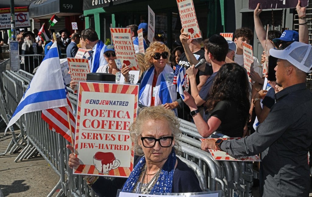Protestors holding signs that read "#ENDJEWHATRED POETICA COFFEE SERVES UP JEW-HATRED" and Israeli flags.