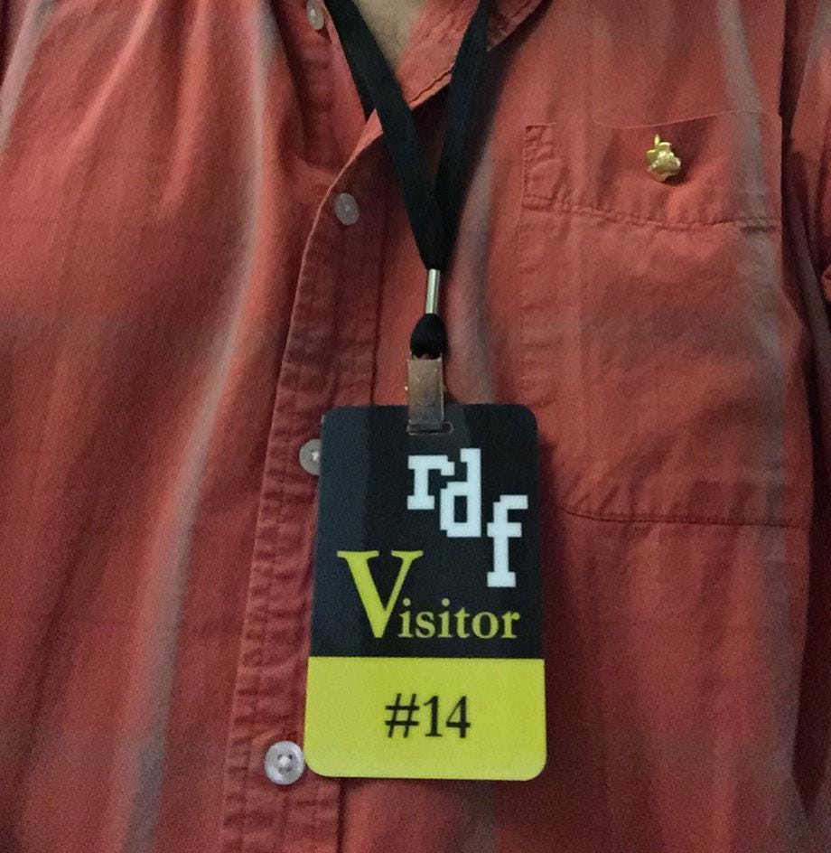 Badge reads "RDF Visitor #14."