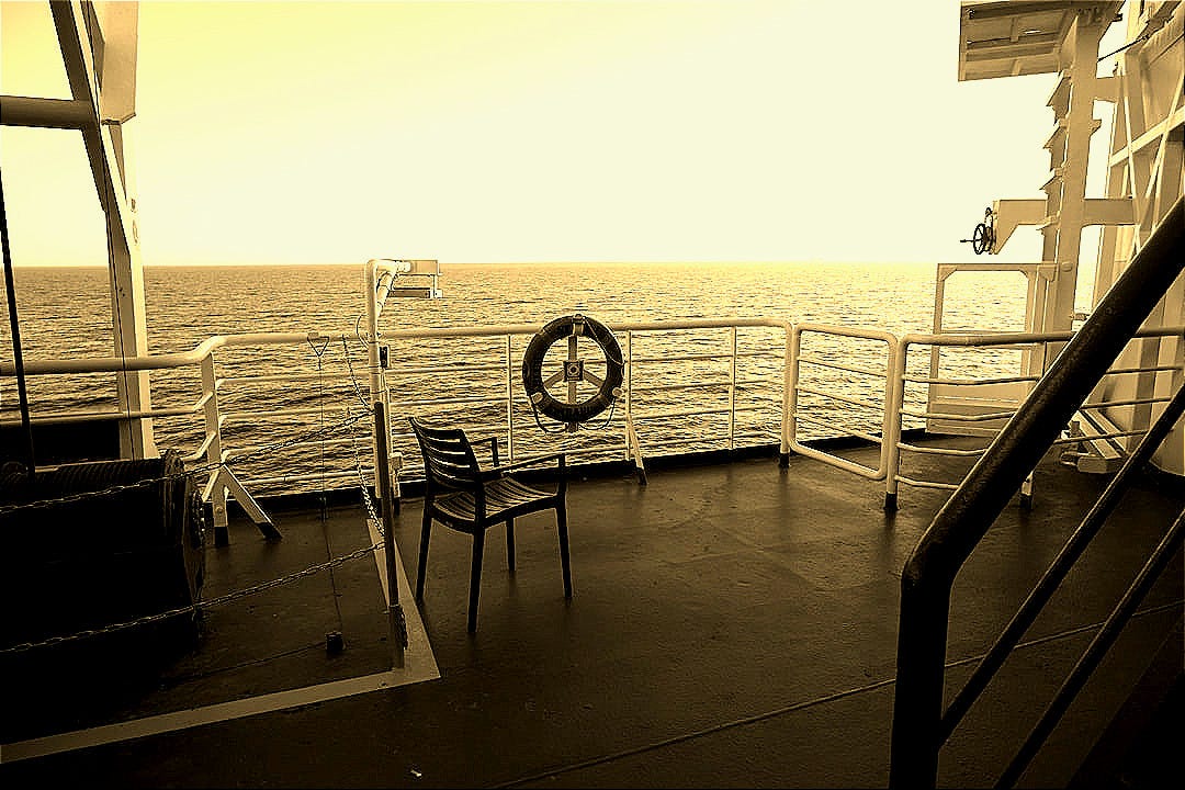 A black and white photo of a boat deck A black and white photo of a boat deck