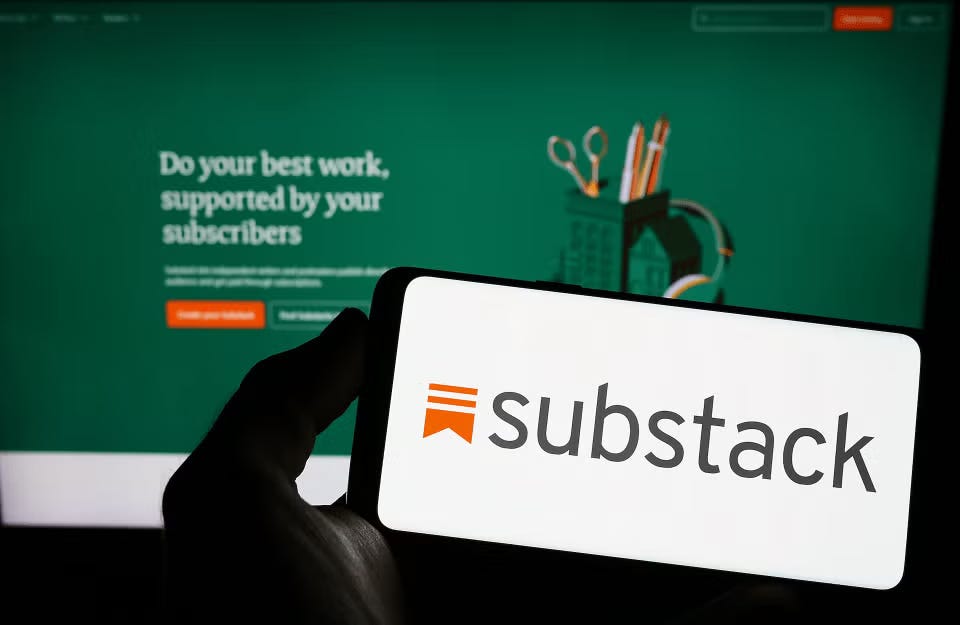 Substack logo on a phone with screen behind it Substack logo on a phone with screen behind it