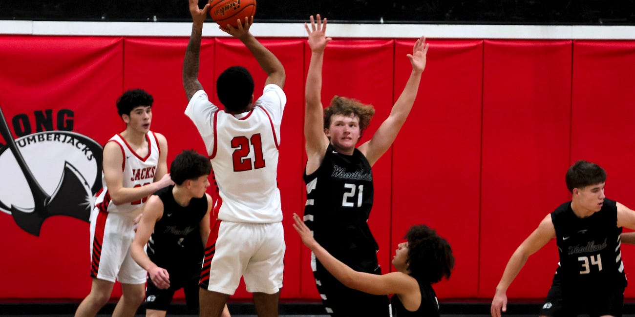 High School Basketball: No. 1 ranked R.A. Long takes No. 2 Woodland to the woodshed