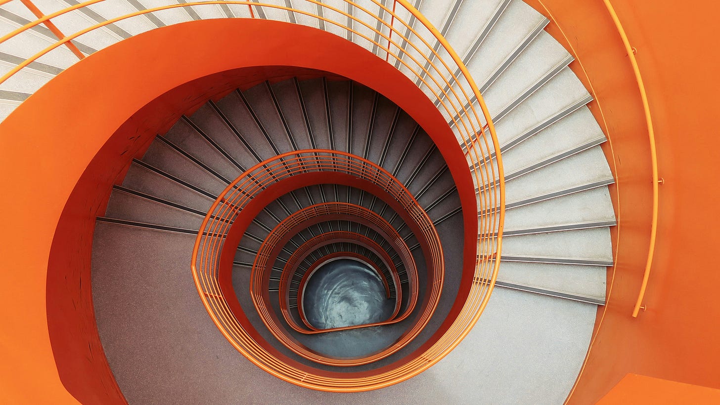 spiral orange and white staircase that never ends spiral orange and white staircase that never ends