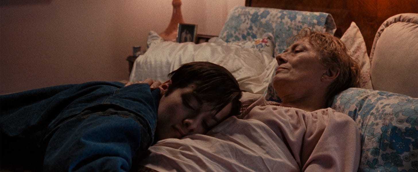 Little Odessa | Still features Edward Furlong as Reuben Shapira in an embrace with Vanessa Redgrave as Irina Shapira.