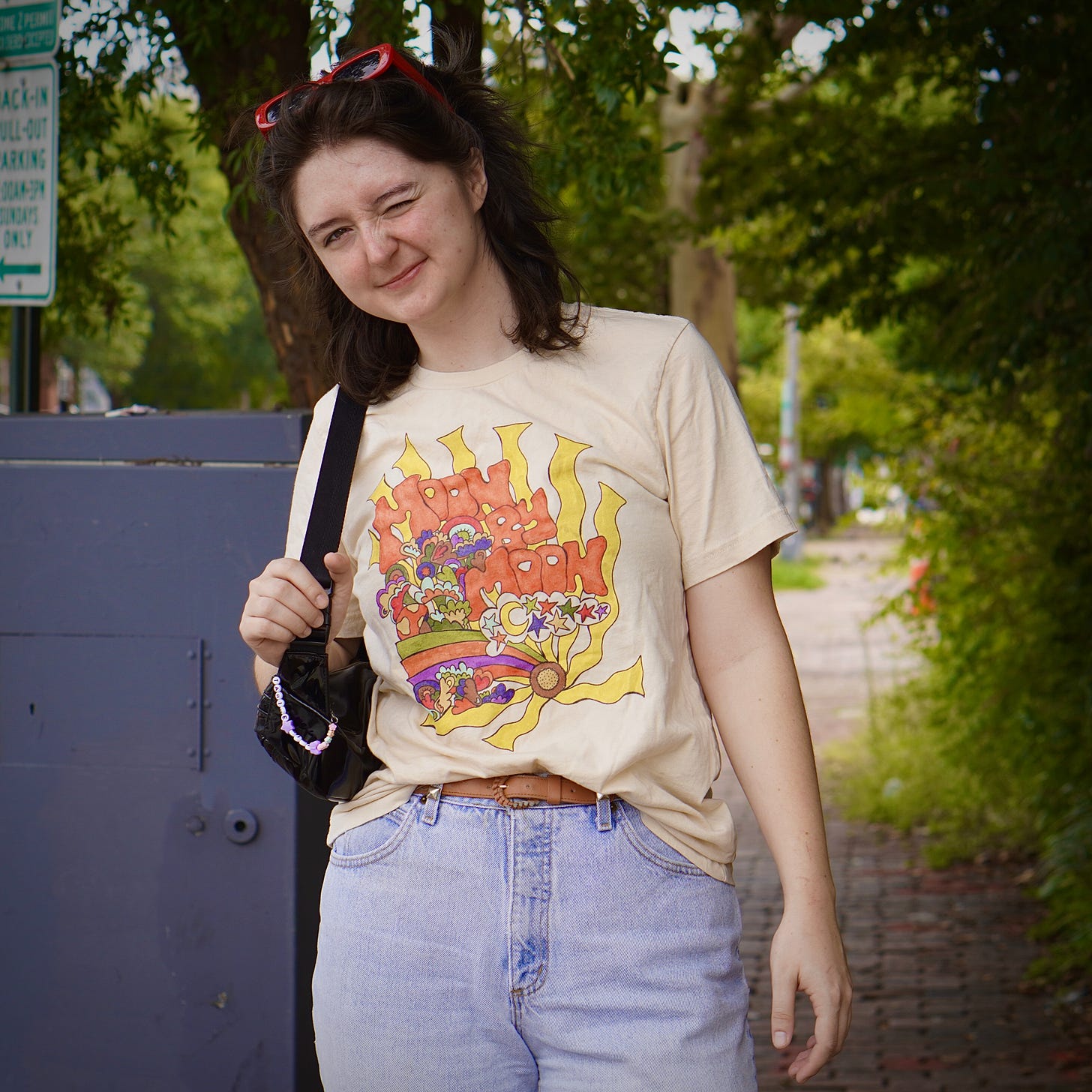 Gabbo, in a Moon by Moon t-shirt and jeans, winks for the camera