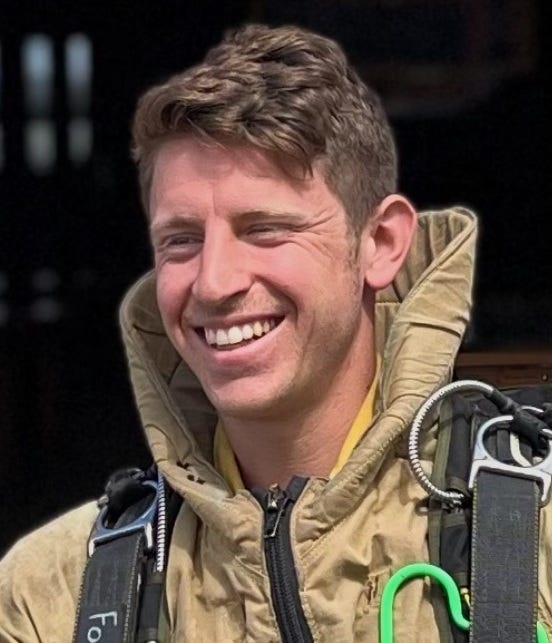 Sam Forstag in 2023; headshot, smiling white man with shortish hair in outdoorsy gear Sam Forstag in 2023; headshot, smiling white man with shortish hair in outdoorsy gear