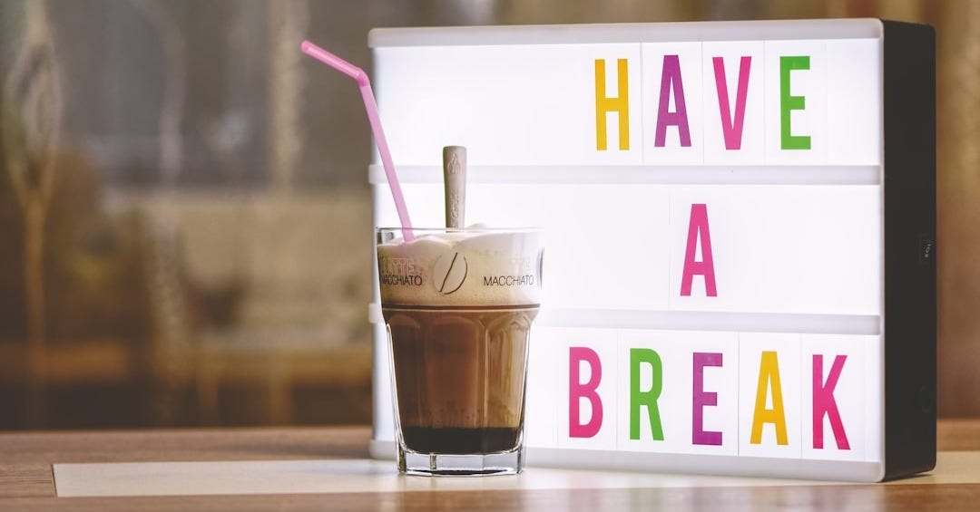 white and brown plastic cup with pink straw white and brown plastic cup with pink straw