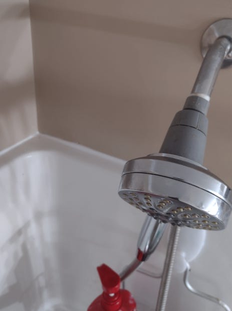Shower area neatly caulked.