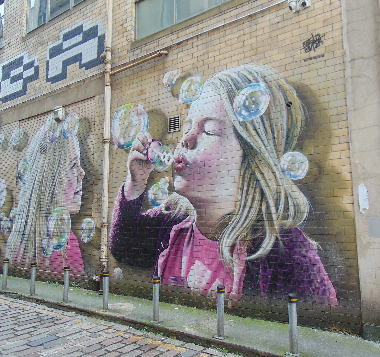 mural of girl blowing bubbles