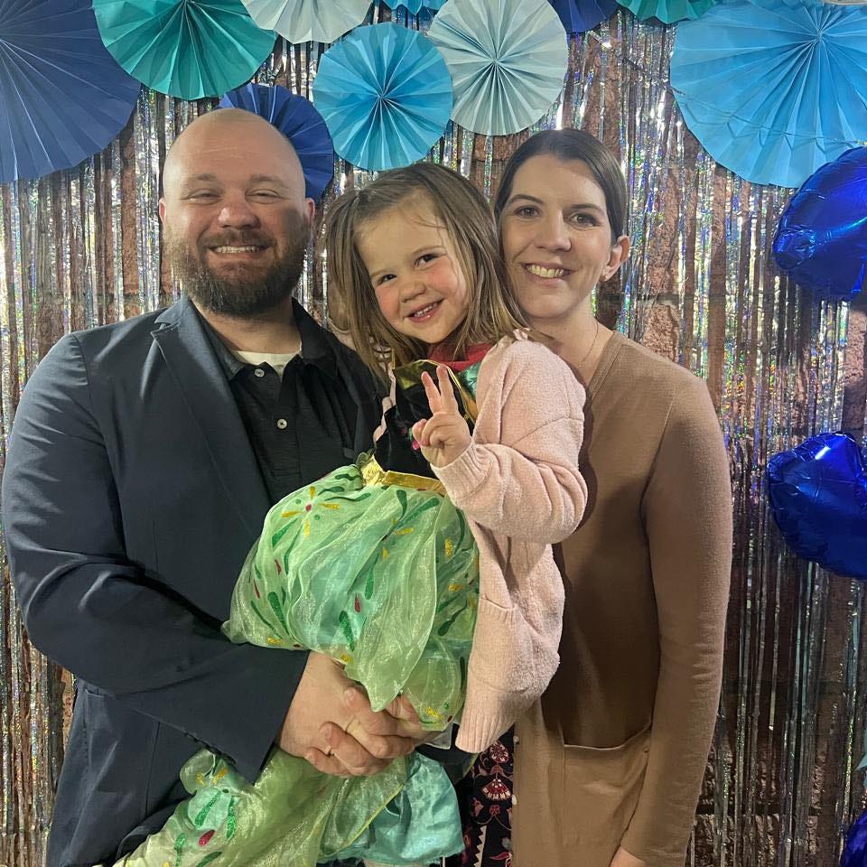 May be an image of 2 people, child and people smiling