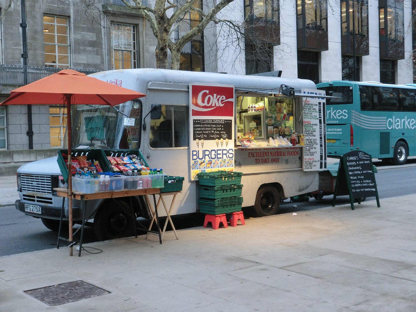 A picture of a silver food van