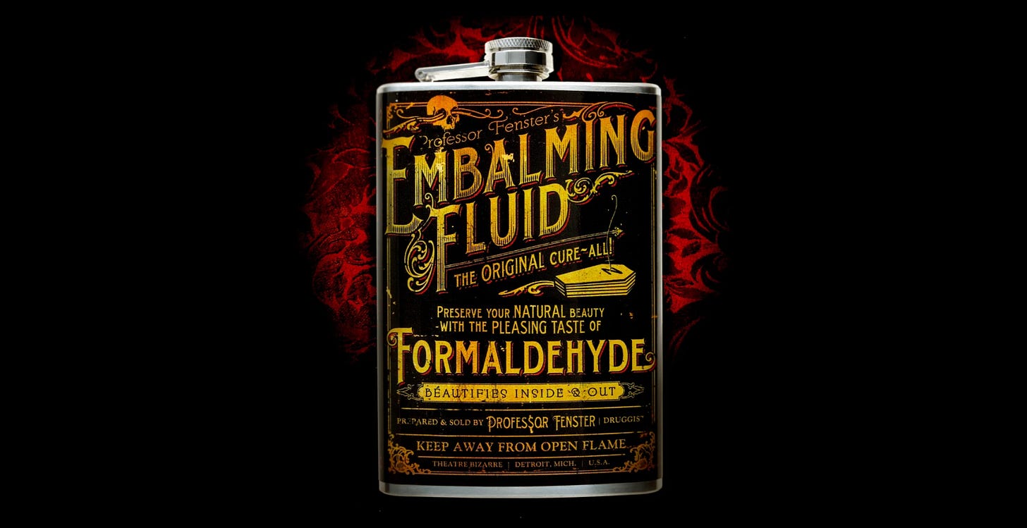 a photo of a liqour flask with an old-timey enbalming fluid logo a photo of a liqour flask with an old-timey enbalming fluid logo