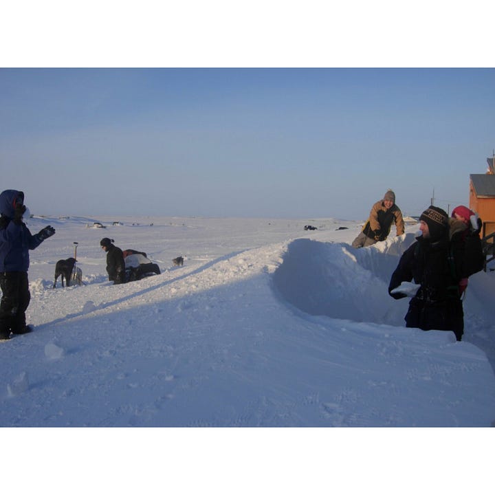 The library-turned-studio in Akiuk School & a photo of the snowbanks formed from the blizzard.