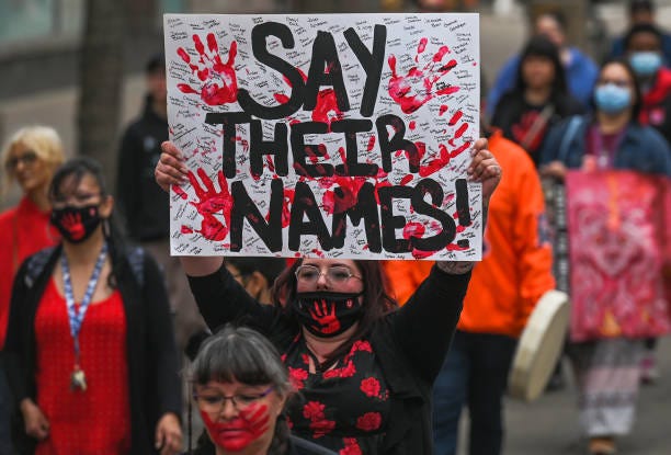 Participants during the annual Red Dress Day march in downtown Edmonton, hosted by Project REDress, commemorating the lives of missing and murdered...