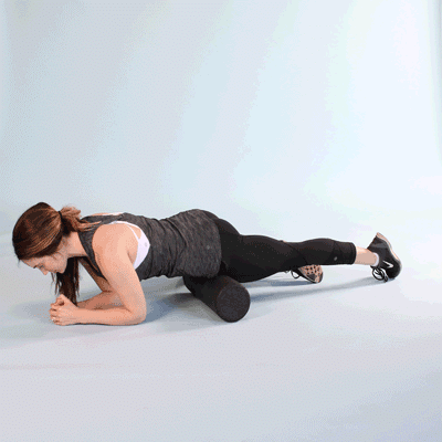 woman foam rolling front of hip