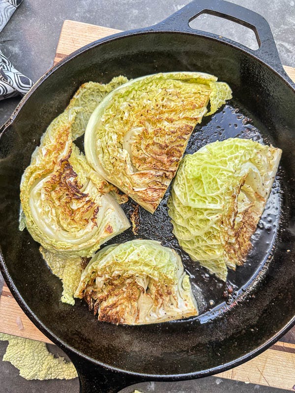 Try this Maple Bacon Cabbage recipe! Roasted cabbage wedges with crispy bacon and a homemade maple Dijon dressing. Easy, flavorful, gluten-free side dish for fall dinners, Thanksgiving, or meal prep. #vegetableside #cabbagerecipes #shutterbean