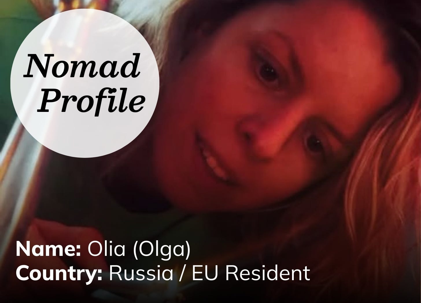 Close up of white woman with long blond hair leaning over a candle. The photo has a dark red hue. Close up of white woman with long blond hair leaning over a candle. The photo has a dark red hue.