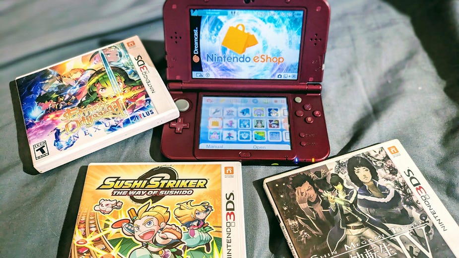 Red Nintendo 3DS displaying "Nintendo eShop" on screen, surrounded by three game cases: "Etrian Odyssey Nexus," "Sushi Striker," and "Shin Megami Tensei IV" on a gray background.