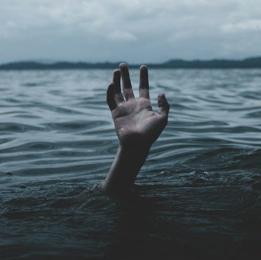 a person drowns underwater a person drowns underwater