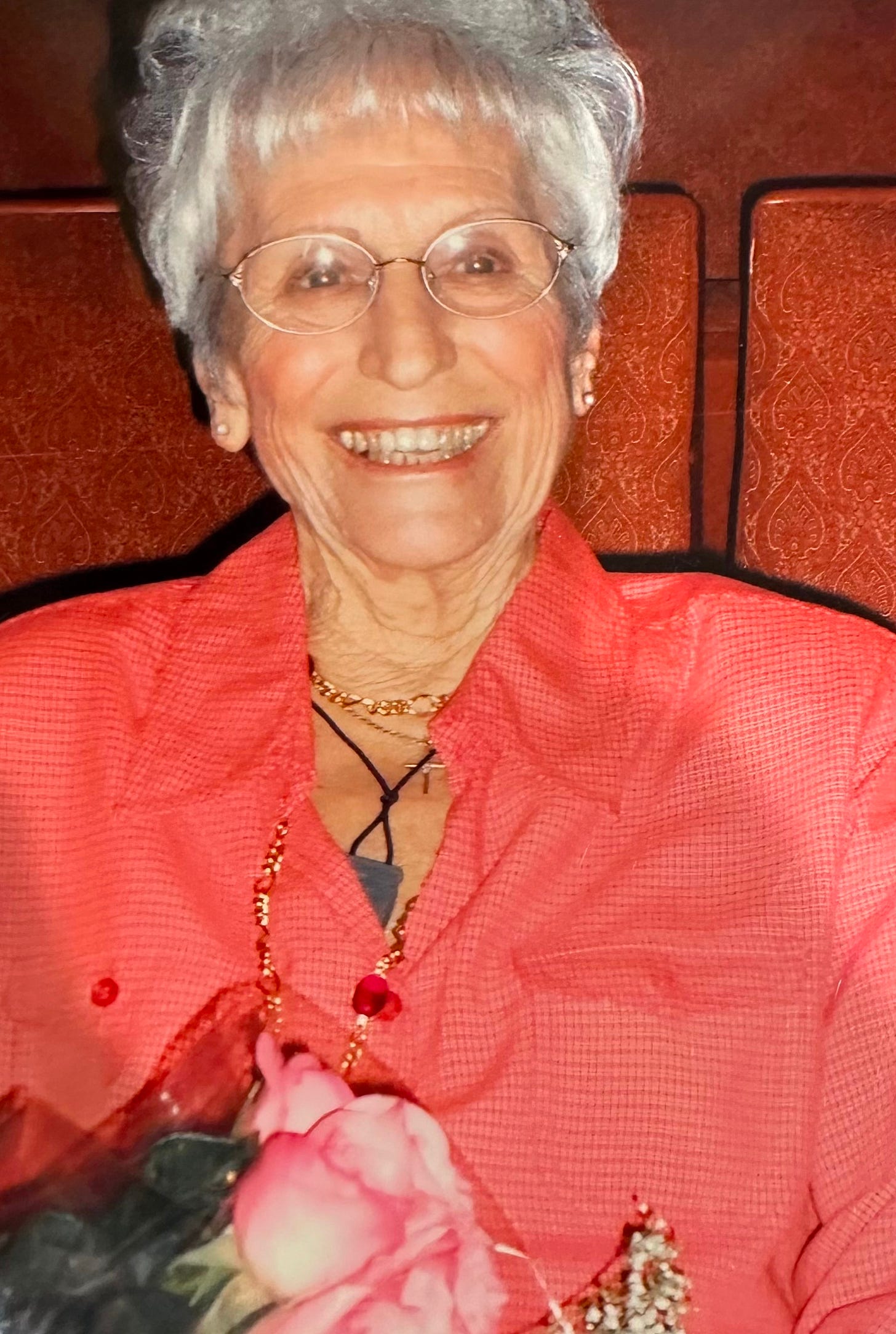 Photo of smiling mother in pink tones