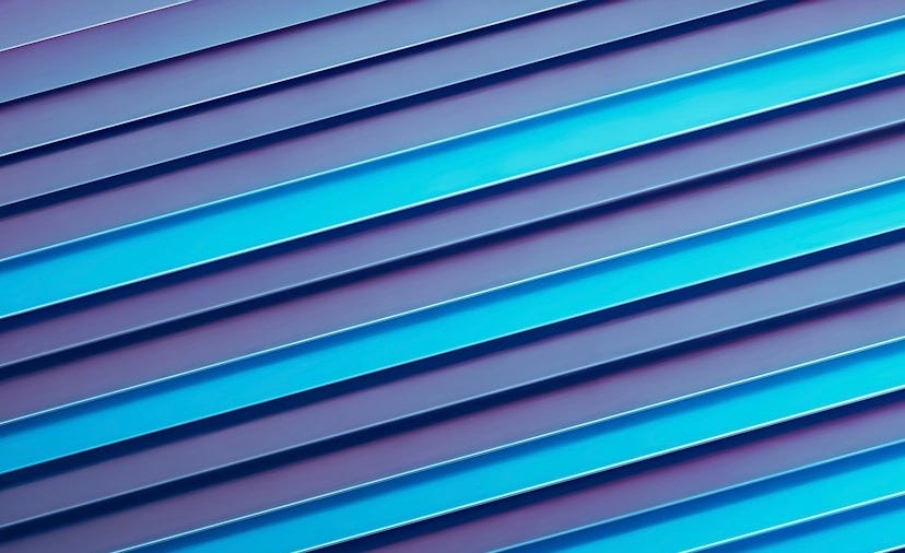 a close up of a blue wall with vertical lines