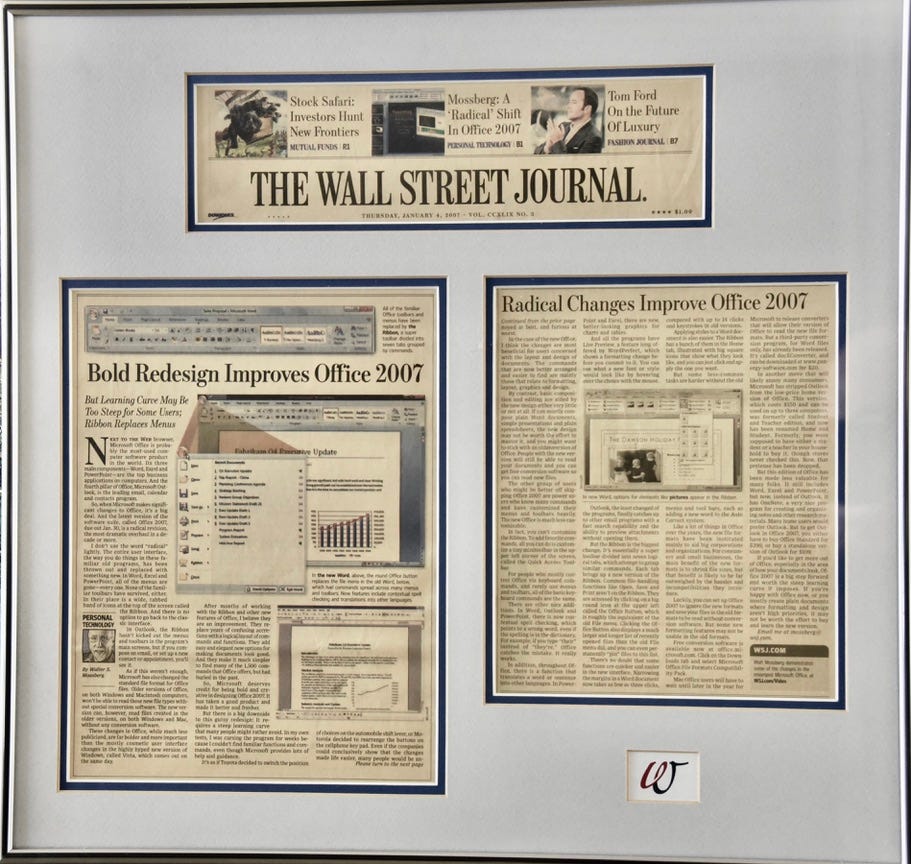 Three sections of a newspaper review cut out and framed in a large frame. The headline in "Bold Redesign Improves Office 2007" and features several screen shots in color. From the Wall Street Journal. Three sections of a newspaper review cut out and framed in a large frame. The headline in "Bold Redesign Improves Office 2007" and features several screen shots in color. From the Wall Street Journal.
