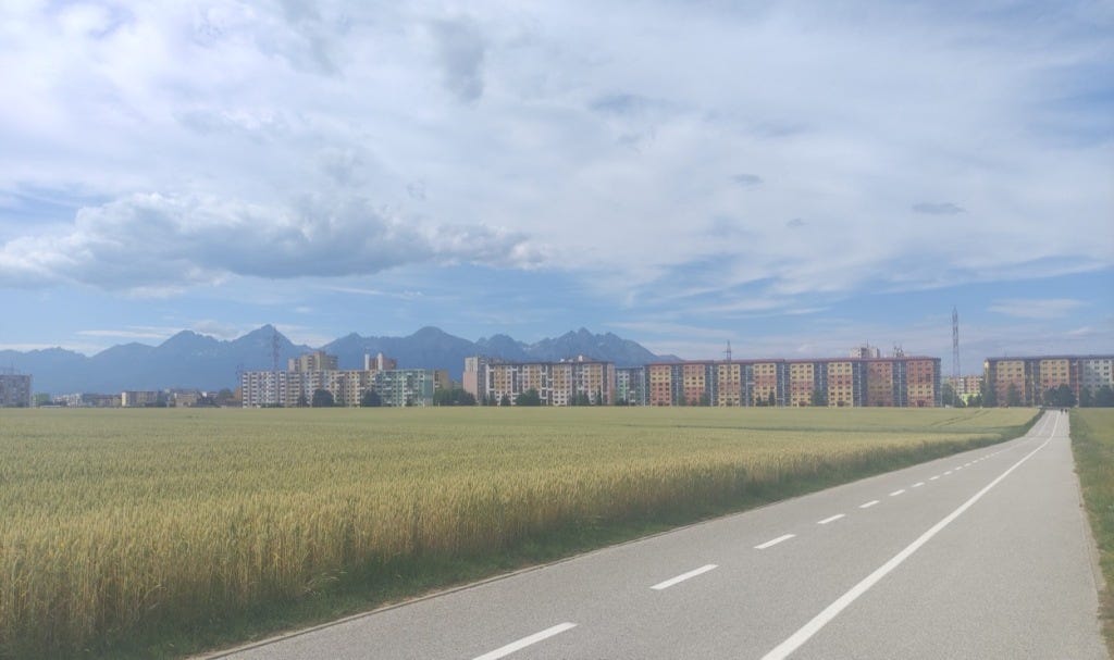 Brutalist apartment blocks of Poprad with mountains behind