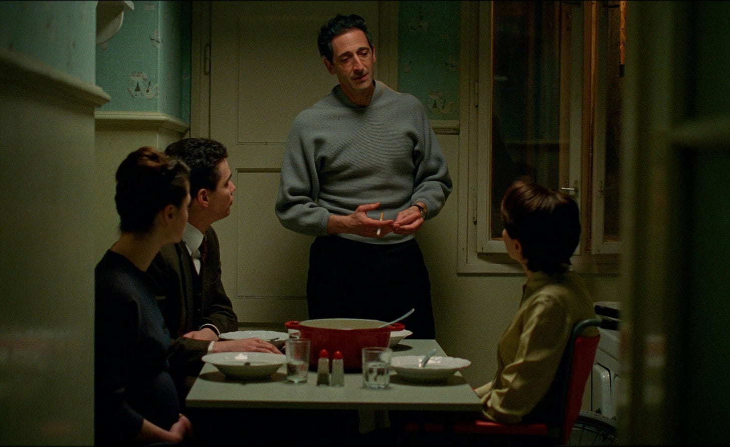 Image may contain Adrien Brody Architecture Building Dining Room Dining Table Furniture Indoors Room Table and Cup