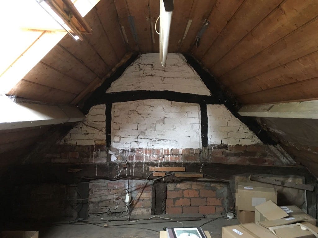 Attic space with original beams and pine cladding
