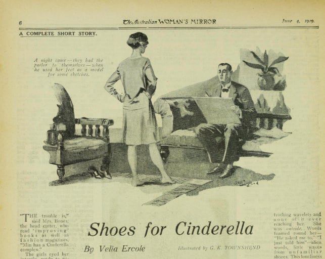 A black and white newspaper clipping featuring a stylised room with a couch and an arrmchair. One person is sitting on the couch  facing forward in a tuxedo and is holding a large rectangle that covers part of their body. The other person is standing towards the person on the couch and we can only see the back half of them. They have their hands on their hips and are weraing a knee length dress.