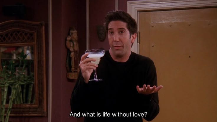 This may contain: a man holding a wine glass in his hand with the caption and what is life without love?