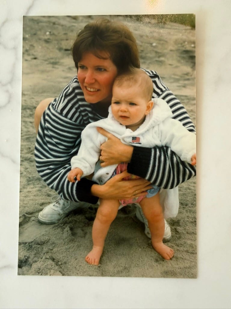Jill with her young daughter on a sandy beach Jill with her young daughter on a sandy beach