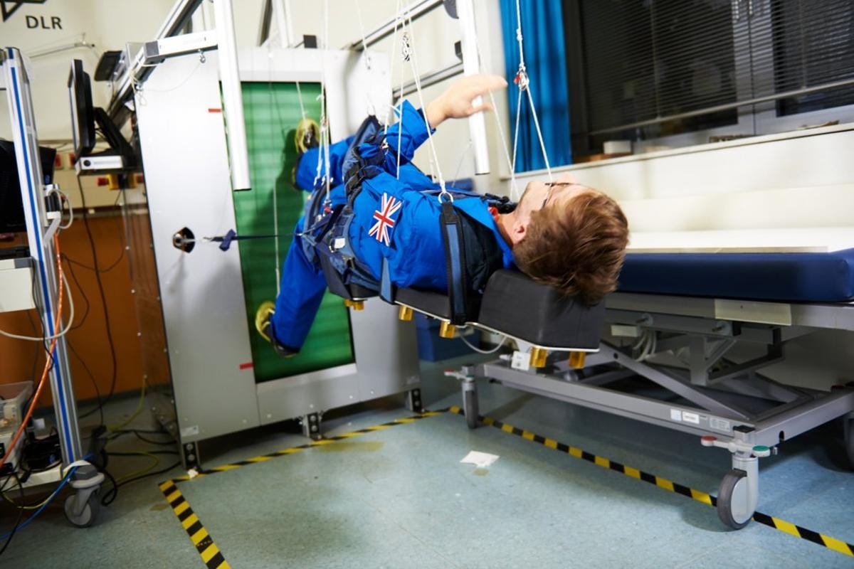 Steffan Powell of the BBC tries out the space treadmill