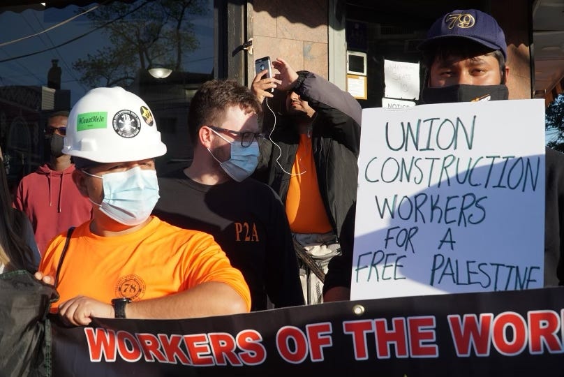 Construction workers hold banners during a protest for Palestine organised by Within Our Lifetime in the Bronx, a borough in New York City. Construction workers hold banners during a protest for Palestine organised by Within Our Lifetime in the Bronx, a borough in New York City.