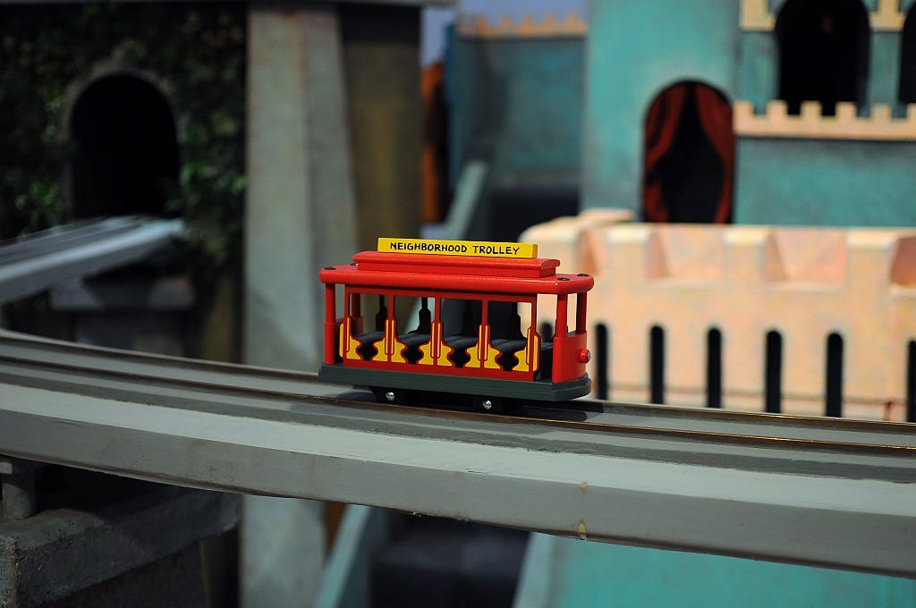 An image of a toy trolley from Mr. Rogers' neighborhood.