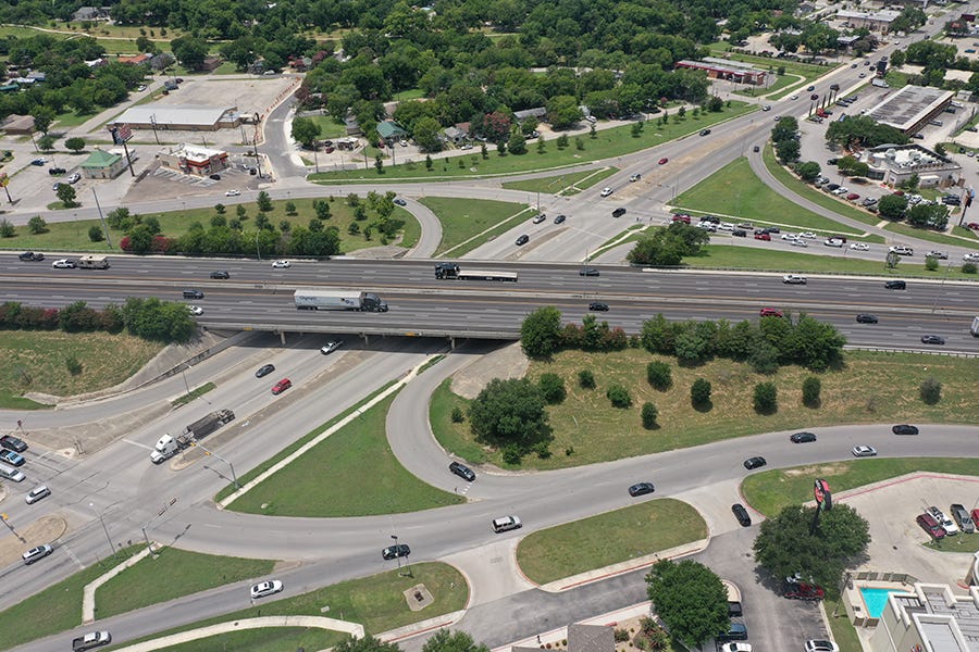 I‑35 highway corridor between San Marcos and Austin during weekday traffic