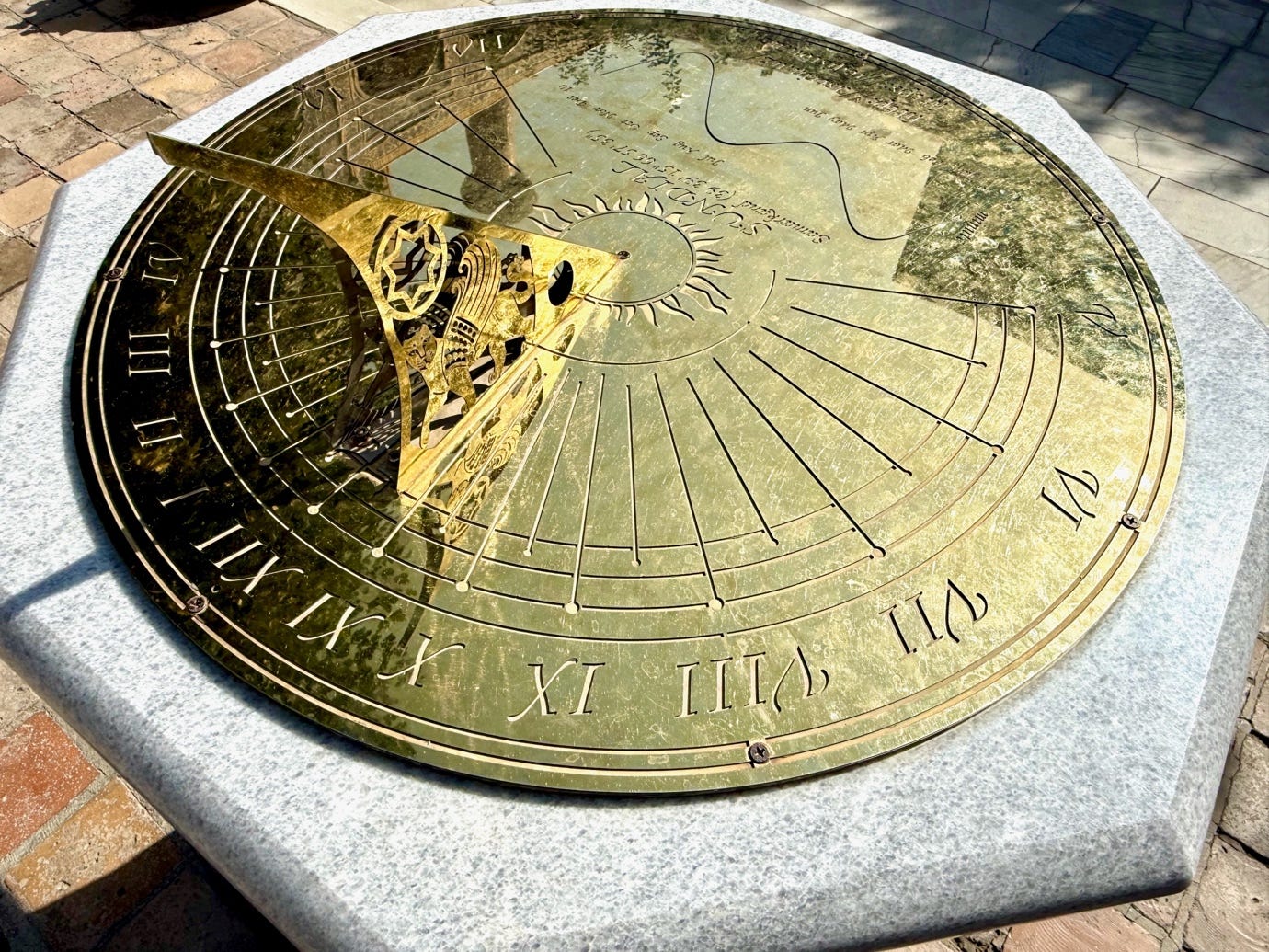 A sundial on a stone surface

AI-generated content may be incorrect.