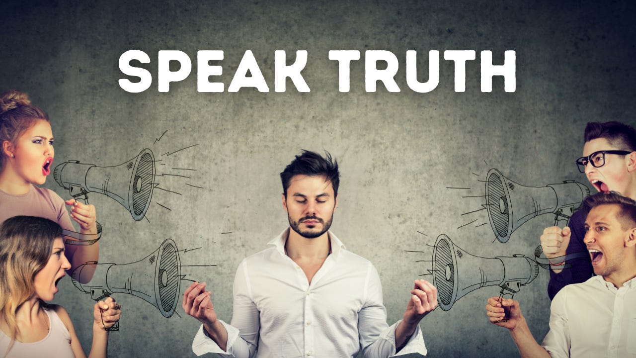 People yelling at a man below the words "Speak Truth." People yelling at a man below the words "Speak Truth."
