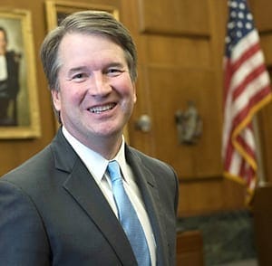 Brett Kavanaugh in a suit smiling