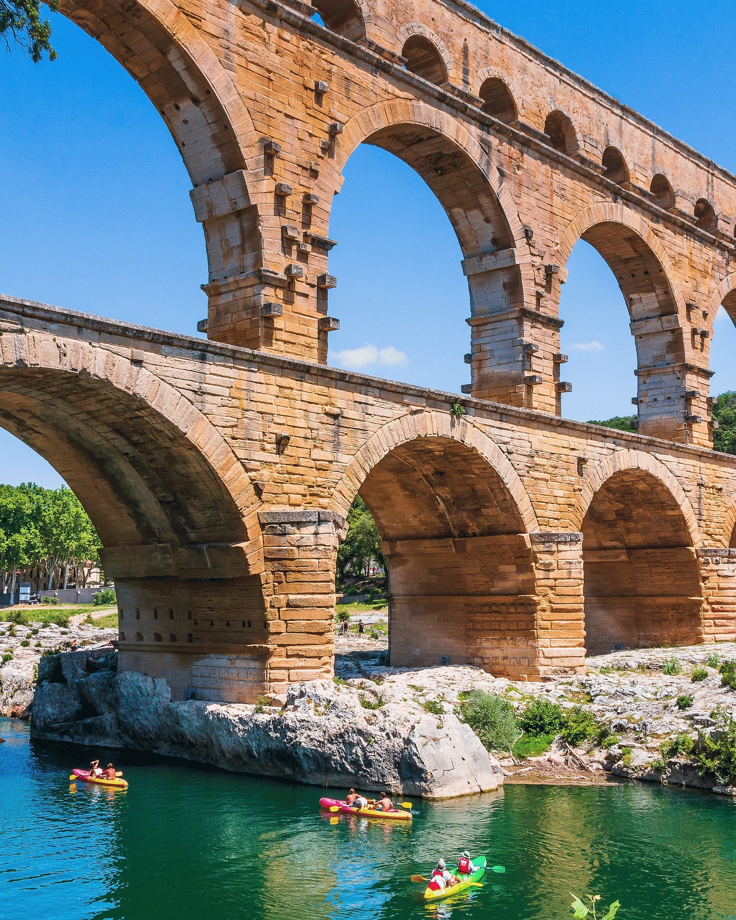 May be an image of 4 people, Stari Most and the Aqueduct of Segovia