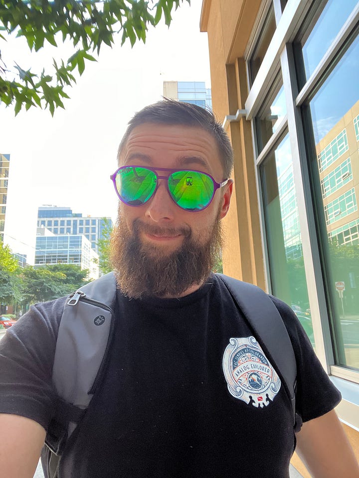 AJ on the streets of seattle looking at camera with backpack on and funky mirror lens purple sunglasses (left). 5 models of Typsim watches on a counter (right)
