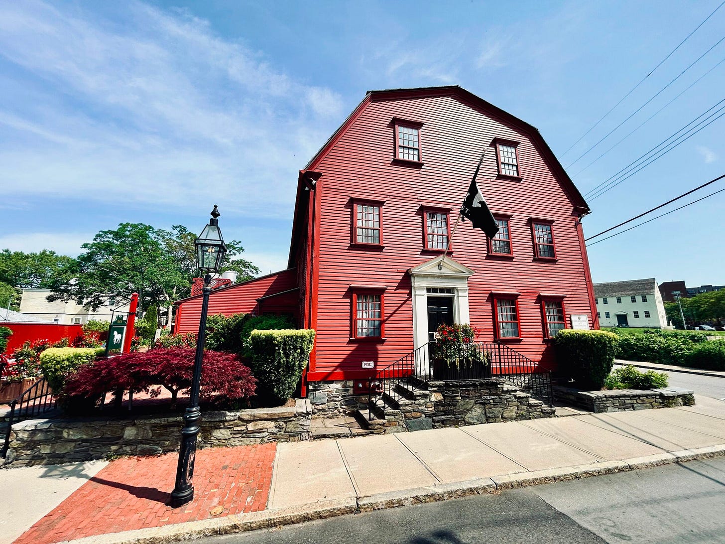 building, trees, sidewalks
