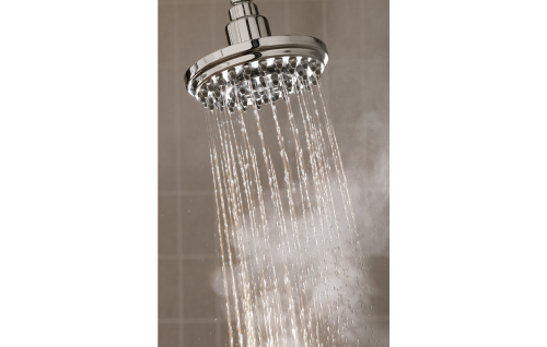 Water streaming from a shower head with steam rising from below.