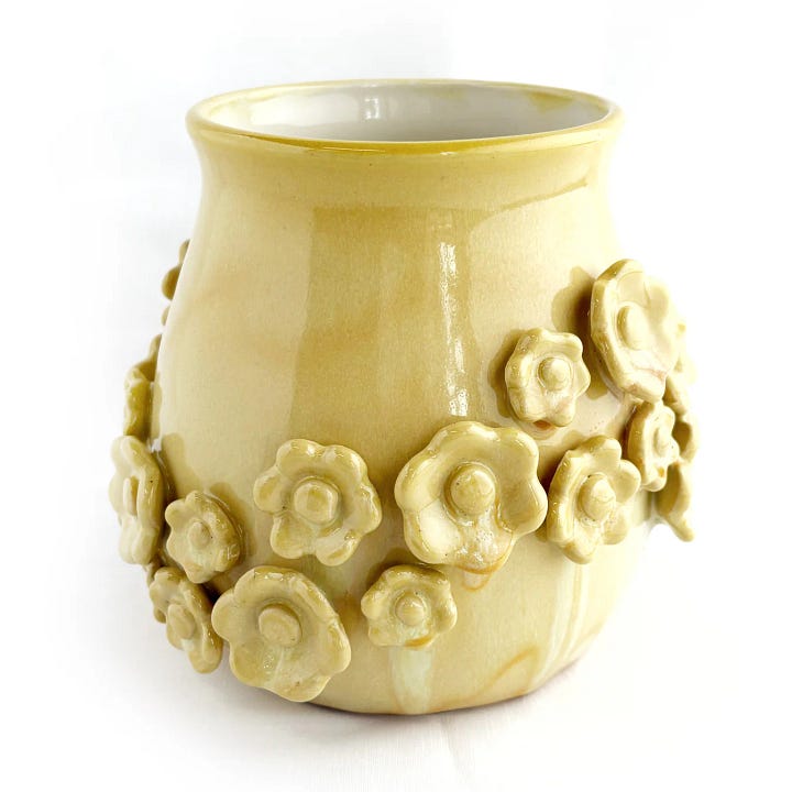 Photo One: a yellow vase with 3D flowers attached.  Photo two: the cover of a zine titled: Two Birds One Stone.