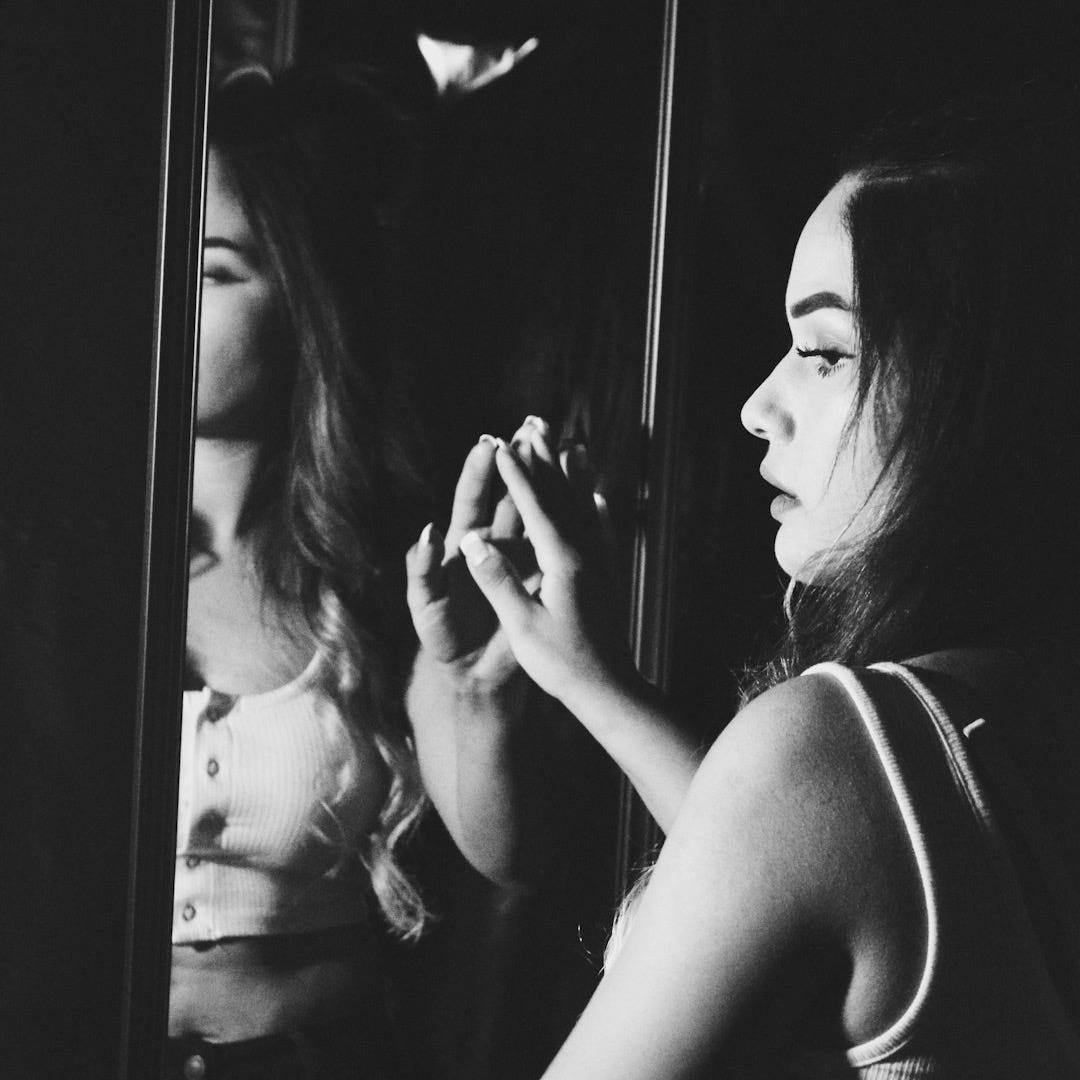 woman in tank top in grayscale photography