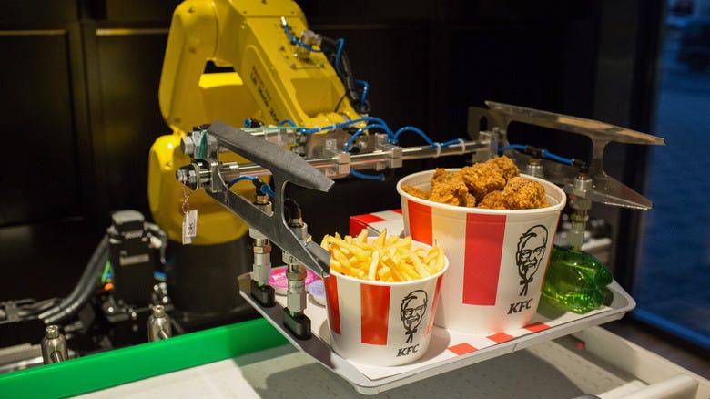 Robotic arm holding KFC meal Robotic arm holding KFC meal