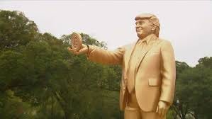 Giant Trump statue holding Bitcoin ...