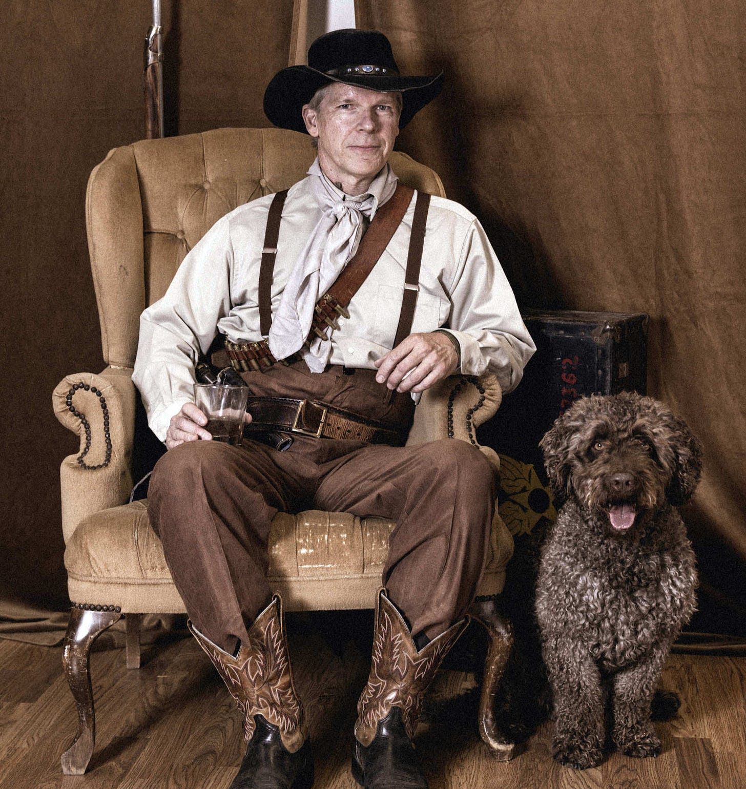The real life Arthur Morgan dressed in old western garb, with Paco the Spanish Water Dog by his side. The real life Arthur Morgan dressed in old western garb, with Paco the Spanish Water Dog by his side.